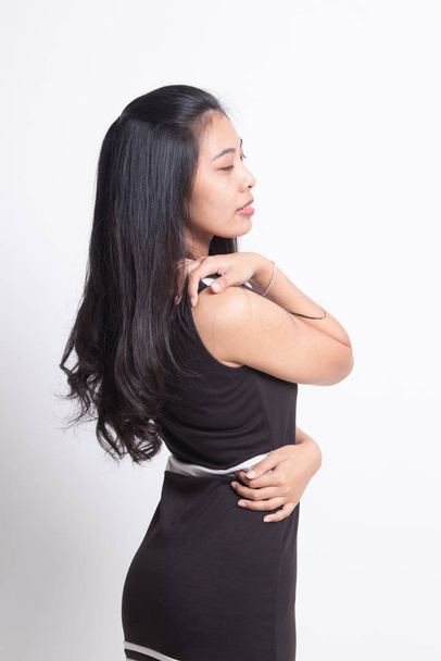Young Asian woman got back pain. - Foto, Imagem
