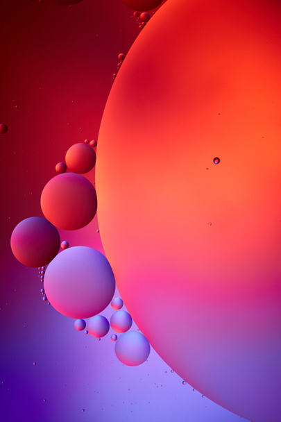 Beautiful abstract background from mixed water and oil bubbles in pink and purple color - Photo, Image