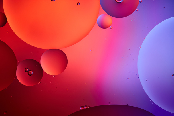 creative abstract background from mixed water and oil bubbles in pink and purple color - Photo, Image