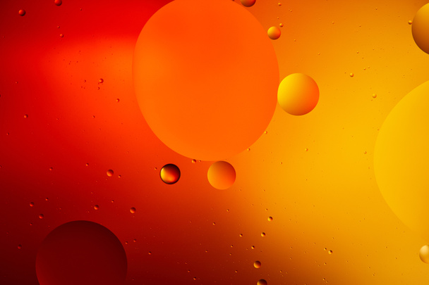 Beautiful abstract background from mixed water and oil in orange color - Foto, Bild