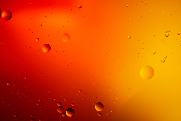 abstract orange and red color background from mixed water and oil  - Фото, зображення