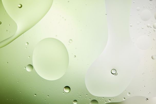 Beautiful light green color abstract background from mixed water and oil - Photo, Image