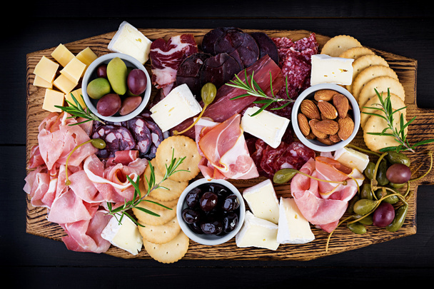 Antipasto platter with ham, prosciutto, salami, cheese,  cracker - Φωτογραφία, εικόνα