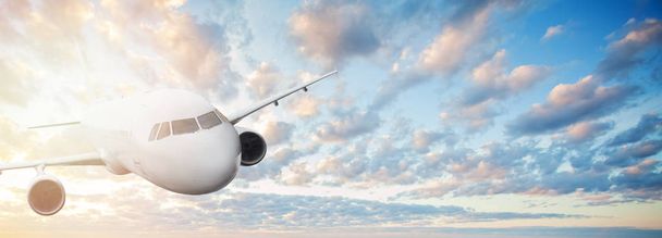 Plane against blue sky with clouds and sun. Travel, holidays  - 写真・画像