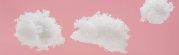 white fluffy clouds made of cotton wool isolated on pink, panoramic shot - Foto, immagini