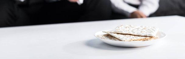 panoramic shot of matza on plate, on wooden plate  - Photo, Image