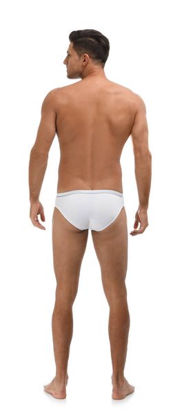 Handsome man in underwear on white background, back view - Фото, изображение