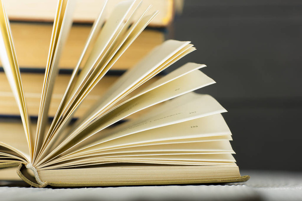 Open book, hardback books on wooden table. Back to school. Copy space - Foto, imagen
