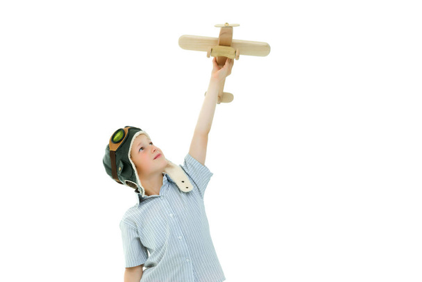 Little boy playing with wooden plane - Foto, Imagem