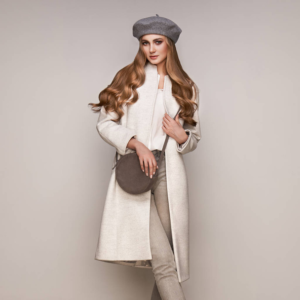 Young woman in white autumn coat - Фото, зображення