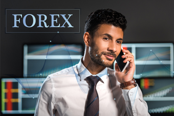 happy bi-racial trader talking on smartphone near forex letters  - Photo, Image