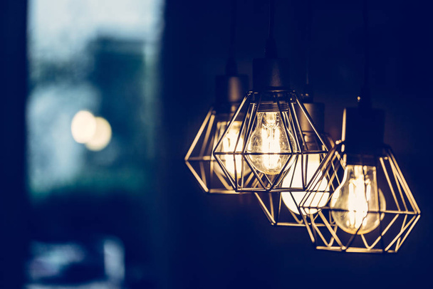 Close up  hanging orange lightbulbs at home, in a restaurant or cafe - Foto, Imagen