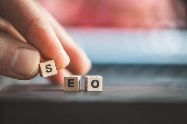 Wood cubes with the word SEO,  picture with copy space. Search engine optimization. - Foto, afbeelding