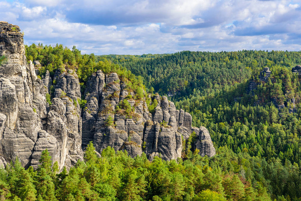 Bastei Rocks in Swiss Saxony, beautiful landscape scenery around the ruins of Neurathen Castle, Elbe Sandstone Mountains in Saxon Switzerland, Germany, Europe. - Фото, изображение