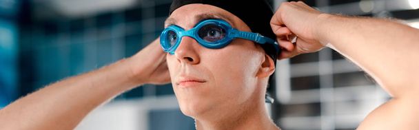 panoramic shot of swimmer wearing goggles  - Photo, Image