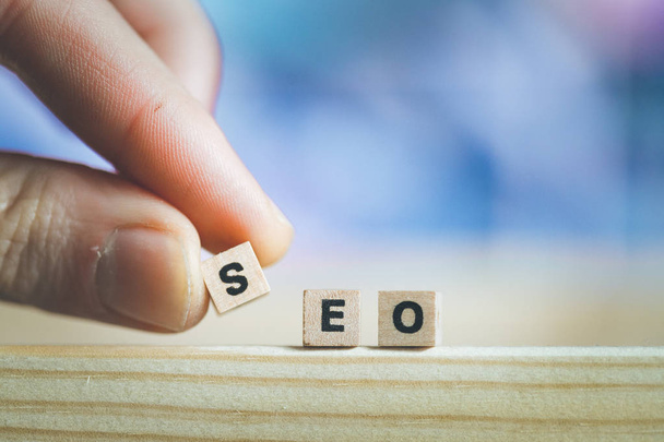 Wood cubes with the word SEO,  picture with copy space. Search engine optimization. - Zdjęcie, obraz