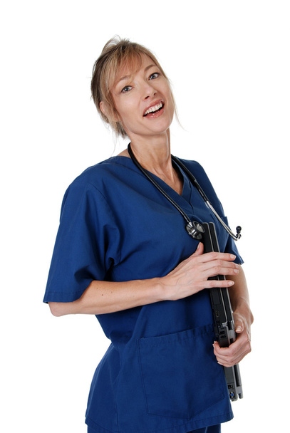 Female nurse carrying a laptop - 写真・画像
