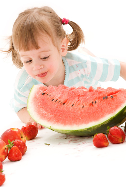 Little girl with strawberry and watermelon - Zdjęcie, obraz
