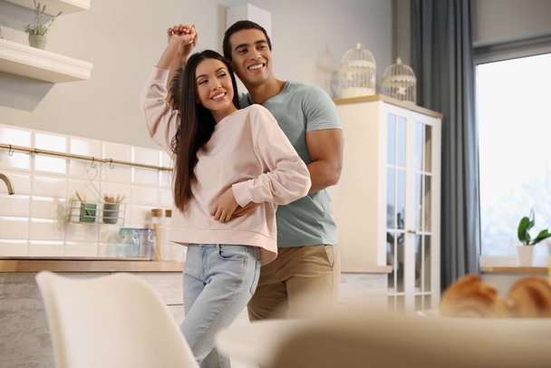 Lovely young interracial couple dancing at home - Photo, Image