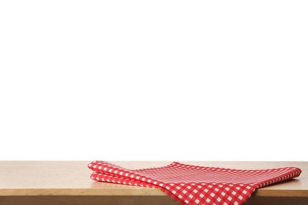 Opgevouwen keukendoek op houten tafel. Ruimte voor ontwerp - Foto, afbeelding