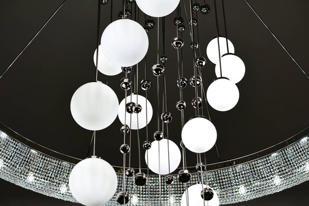 Large chandelier with round shades and metal balls - Φωτογραφία, εικόνα