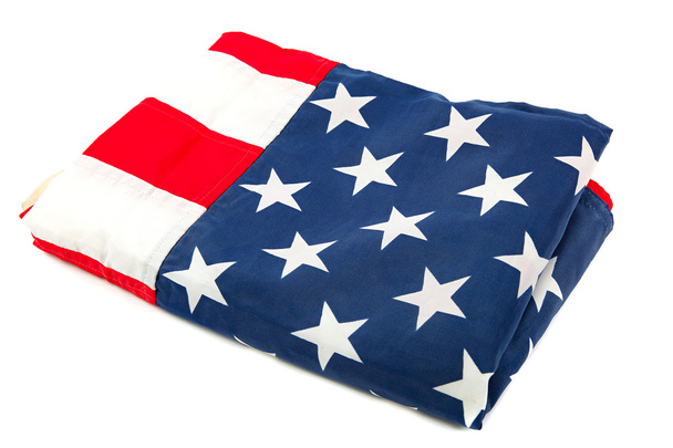 The United States flag, folded on a white background. - Photo, Image