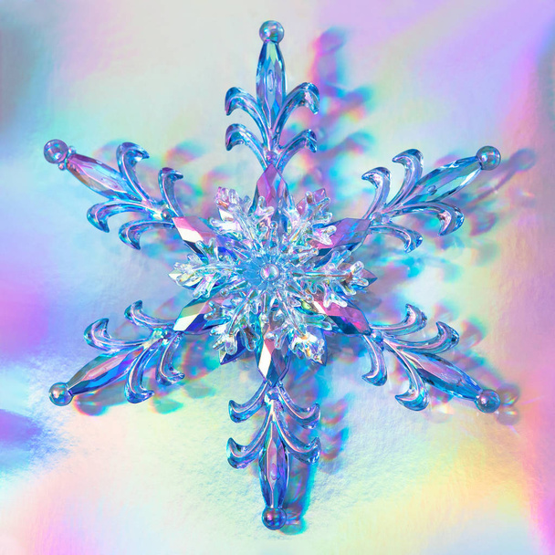 clear glass snowflake on trendy pastel colored holographic backg - 写真・画像