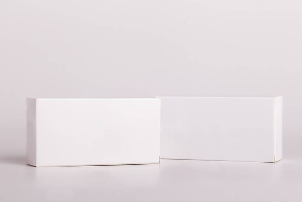 White pills box. Plastic bottles. Drugs box mock-up. Medical blank cardboard. Mockup. Pills bottle - Фото, изображение