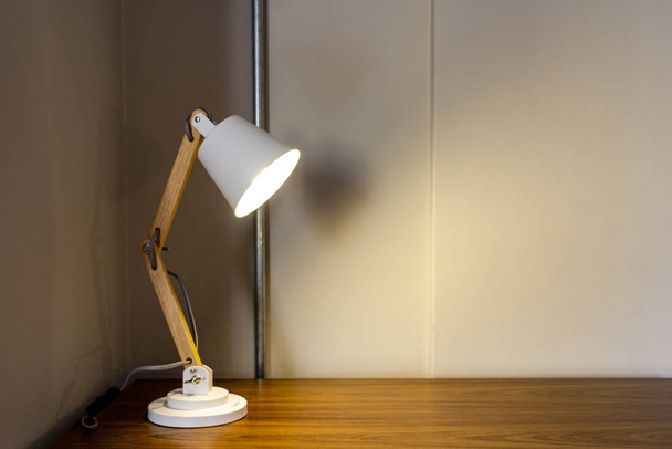 Modern lamp on wood furniture. - Foto, Imagem