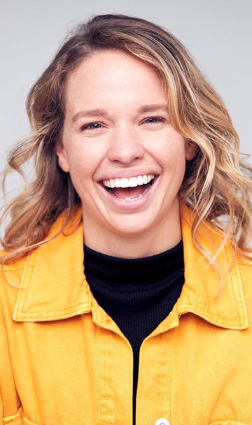 Studio Portrait Of Positive Happy Young Woman Smiling At Camera - Fotografie, Obrázek
