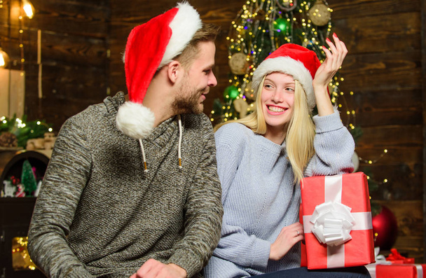 Holiday celebrated around world. Boyfriend girlfriend family celebrate winter holiday. Making gift is art. Couple christmas holiday celebration. Guess her dreams. Giving gift. Gift she exactly wants - Valokuva, kuva