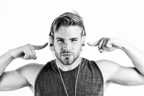 Bearded man wearing adjustable headset. relax playlist. sexy muscular man listen music from playlist. man relax in earphones isolated on white. unshaven man relax with favorite song - Fotoğraf, Görsel