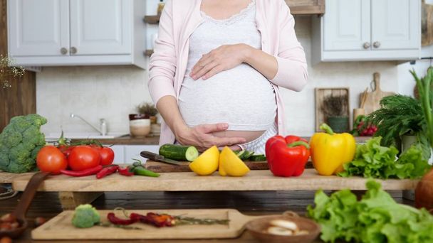 Pregnant Woman Cooking Healthy Food At Home In Kitchen. - Valokuva, kuva