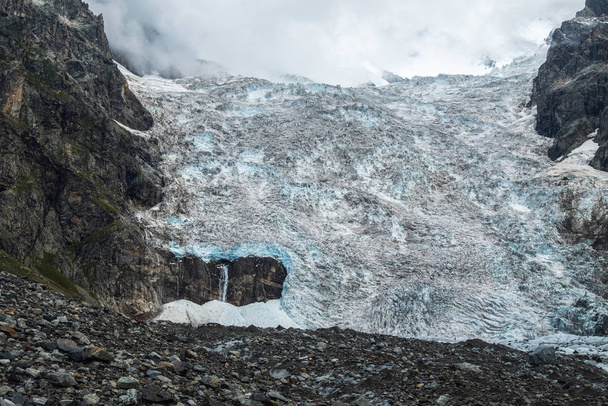 Amazing view to full Adishi glacier icefall and its small waterfall in mountains of Svaneti Georgia - Zdjęcie, obraz