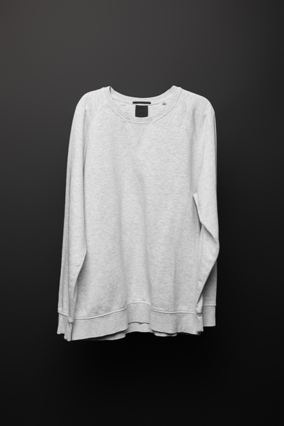 blank basic grey sweatshirt isolated on black  - Фото, изображение