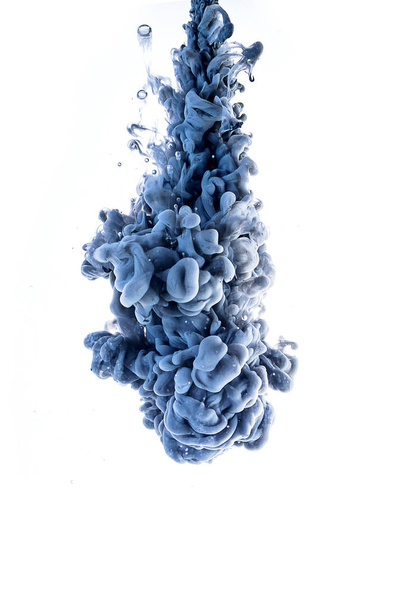 Blue ink falling in the water on white background. - Foto, Imagen