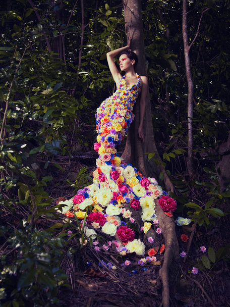 Beautiful lady in dress of flowers - Photo, image