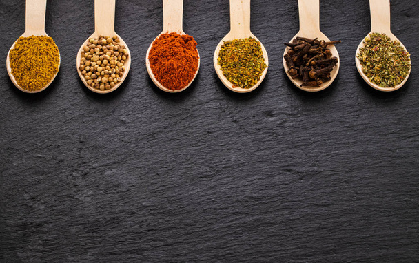 Various spices on dark background. Top view with copy space - Photo, Image