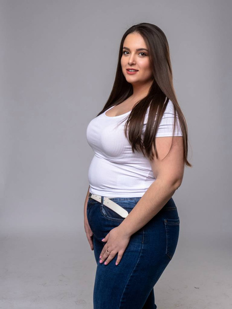 Plus Size Model with long hair in studio - Фото, изображение
