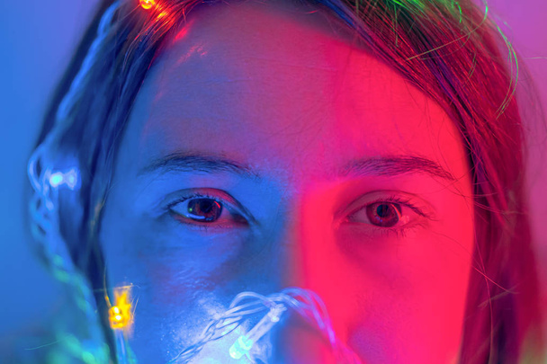 Portrait of a woman in neon lights. Concept of party, celebration, making a wish or new year evening party - Φωτογραφία, εικόνα