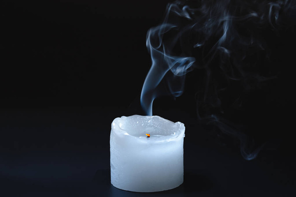 Smoke rising from a dipped candle. - Photo, image