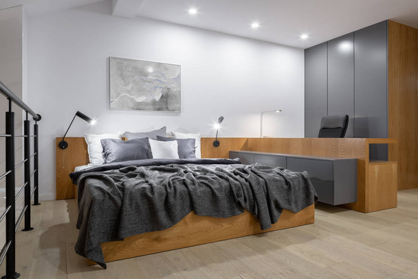 Stylish bedroom with wooden furniture - Zdjęcie, obraz