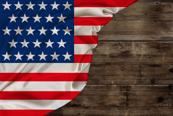 color national flag of modern state of USA, beautiful silk, background old wood, concept of tourism, economy, politics, emigration, independence day, copy space, template, horizontal - Photo, Image