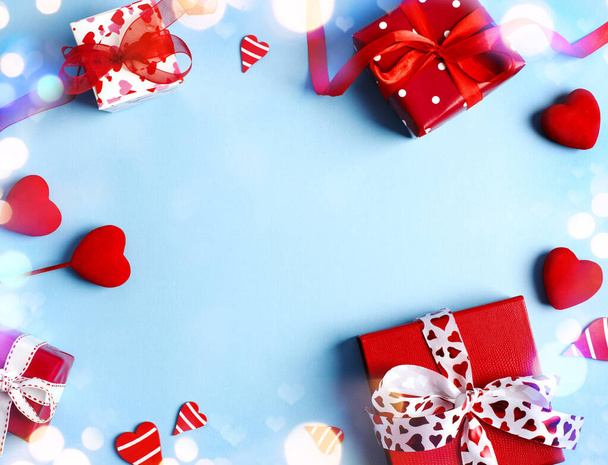 Holiday gifts. Red gift boxes on blue background. Valentines day - Fotoğraf, Görsel