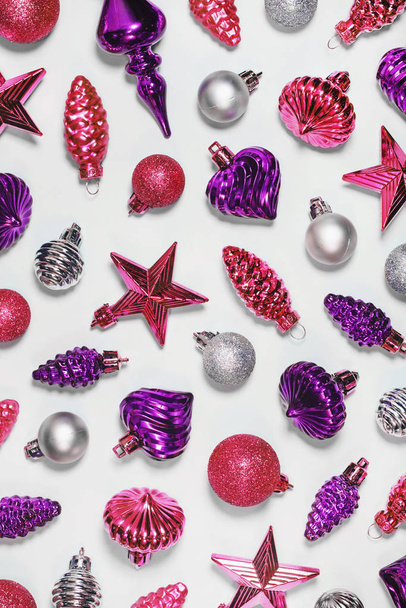 Retro Xmas ornaments decorative background. Vintage Christmas tree toys, festive decorations. Silver, golden and purple baubles, cones, stars. New Year horizontal backdrop for card. - Фото, зображення