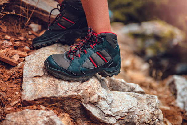 Hikers boots on rock - Foto, imagen