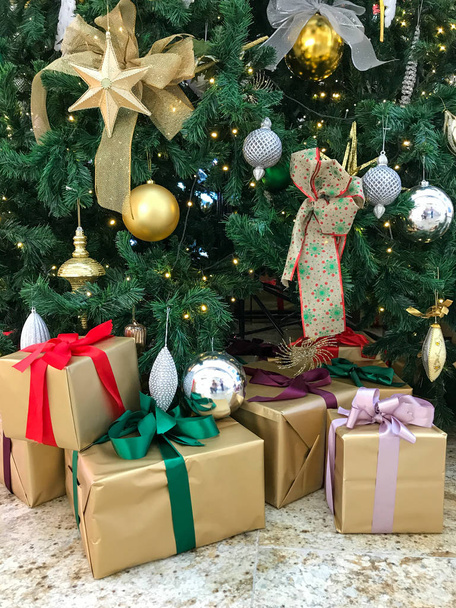 Christmas tree decoration with different toys. New Year pine tree with presents.  - Zdjęcie, obraz
