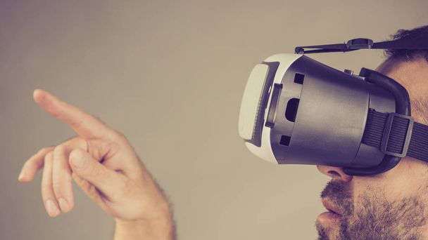 Adult man wearing vr goggles - Photo, image