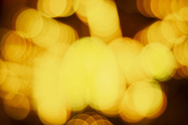 Christmas holiday abstract texture lights yellow bokeh background - Photo, image