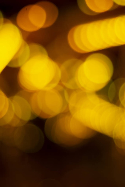 Christmas holiday abstract texture lights yellow bokeh background - Zdjęcie, obraz